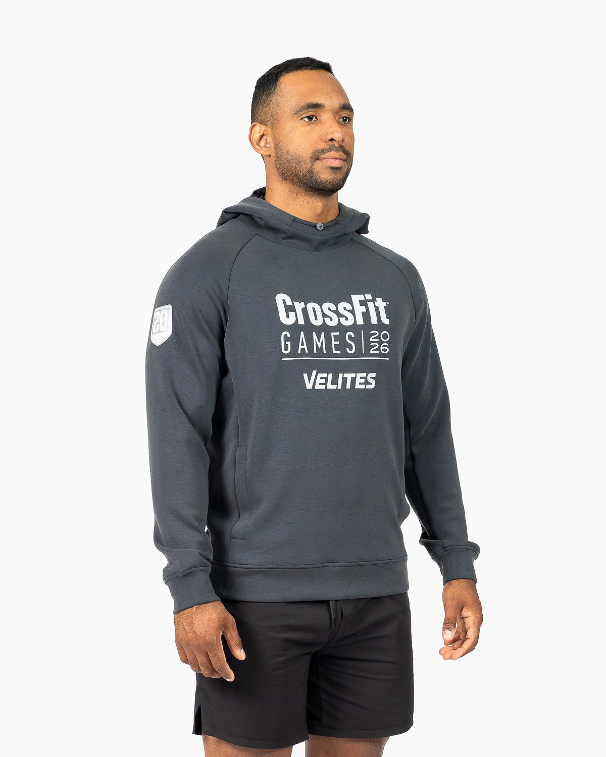 Model wearing the black unisex HOLO CrossFit Games 2026 hoodie by Velites, three-quarter view