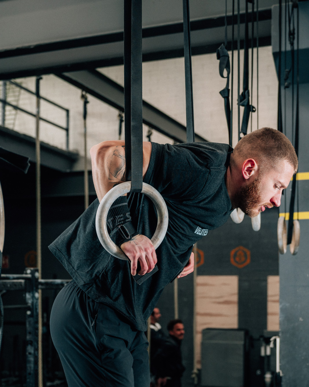 Athlete performing ring dips wearing Velites grips – maximum grip and durability for CrossFit training