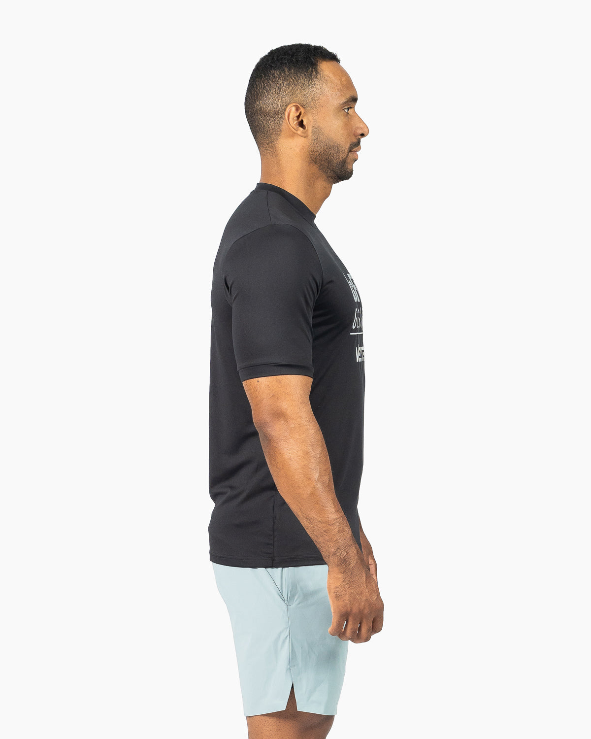 Side profile view of the black unisex training t-shirt showing its regular shoulder fit