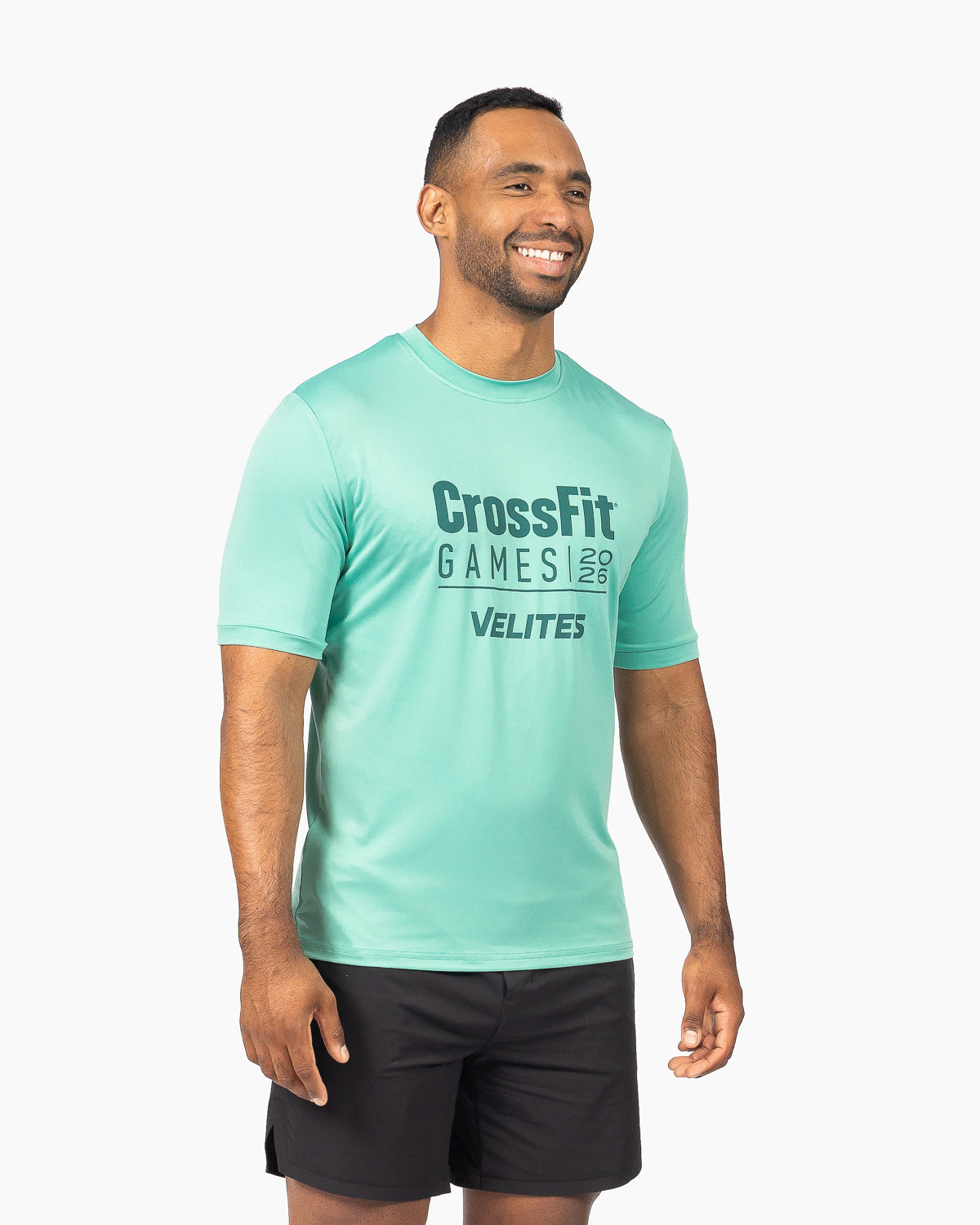 Model wearing the short-sleeve crewneck training tee in wasabi green by Velites